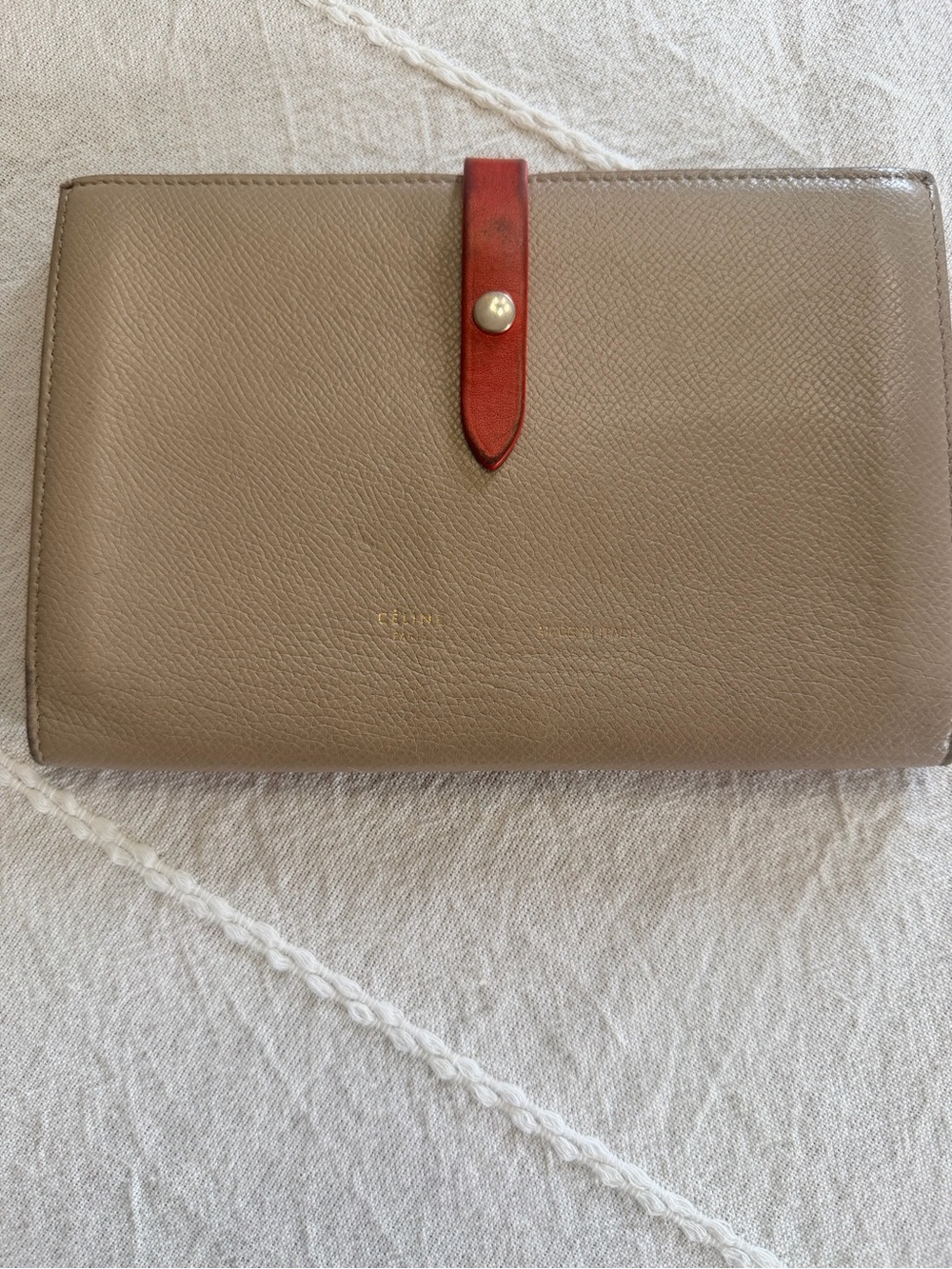 Celine taupe leather wallet with red strap and gold-tone snap